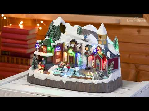 Weihnachtsdorf, mit Skifahrern und rotierenden Schlittschuhläufern, h 24 cm, mit Weihnachtsliedern 2 Weihnachtsdorf, mit Skifahrern und rotierenden Schlittschuhläufern, h 24 cm, mit Weihnachtsliedern 2