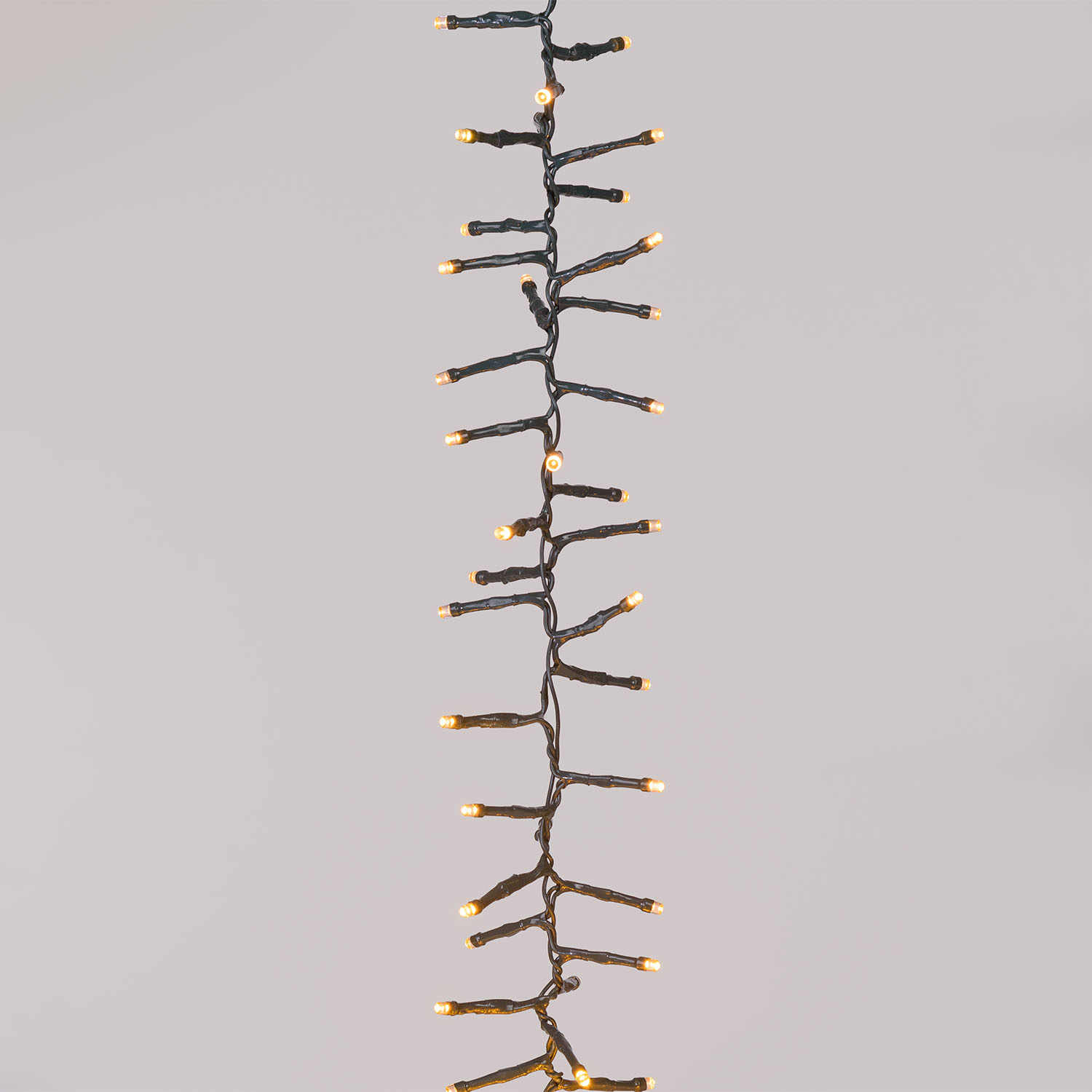 Hängende Clusterbänder Connect+ 6 m, 600 warmweiße LEDs, grünes Kabel 4 Hängende Clusterbänder Connect+ 6 m, 600 warmweiße LEDs, grünes Kabel 4