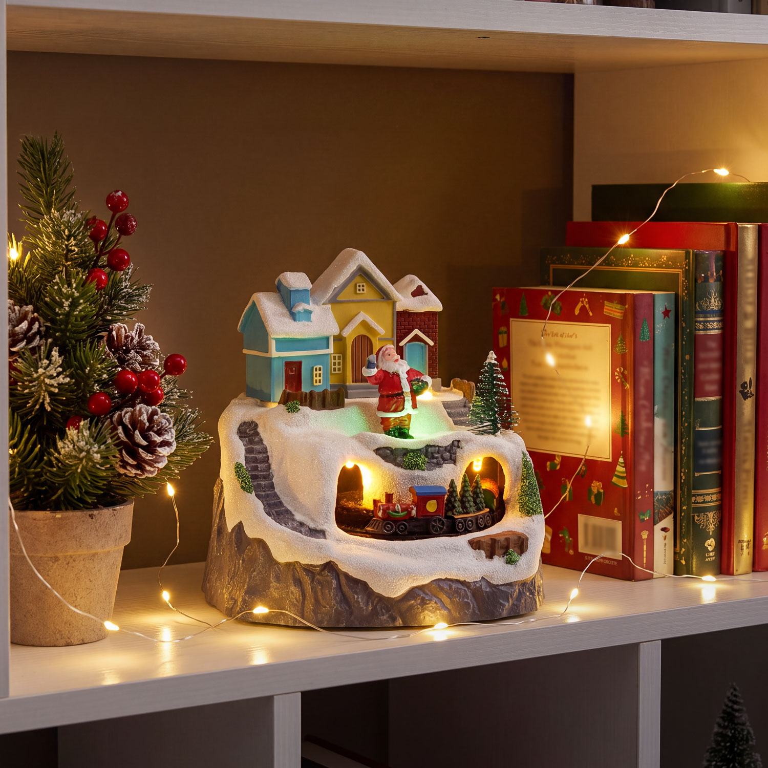 Pueblo de Navidad en poliresina, paisaje con Papá Noel y trencito giratorio, h 14,5 cm