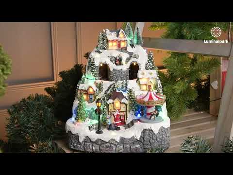 Pueblo de Navidad nevado con Trenecito, Árbol y Tiovivo giratorios, h 31 cm, villancicos 2