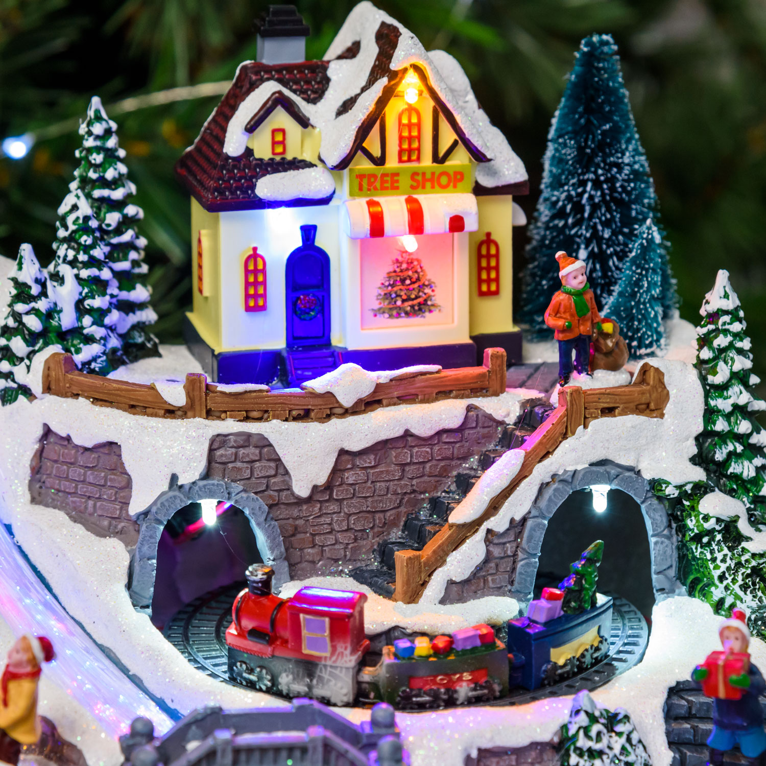 Weihnachtsdorf aus Polyresin, Spielzug, Tunnel und rotierenden Geschenken, h 19 cm, mit Weihnachtsliedern 10 Weihnachtsdorf aus Polyresin, Spielzug, Tunnel und rotierenden Geschenken, h 19 cm, mit Weihnachtsliedern 10