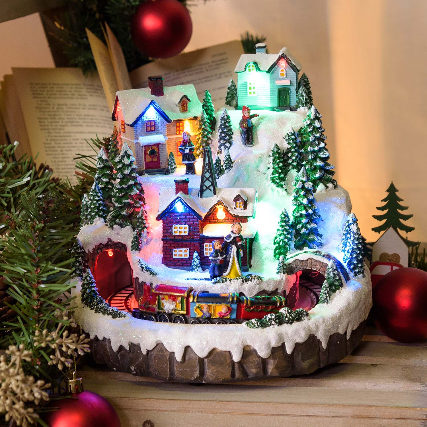 Snowy Christmas village and train with rotating movement, h 22 cm, Christmas music Snowy Christmas village and train with rotating movement, h 22 cm, Christmas music