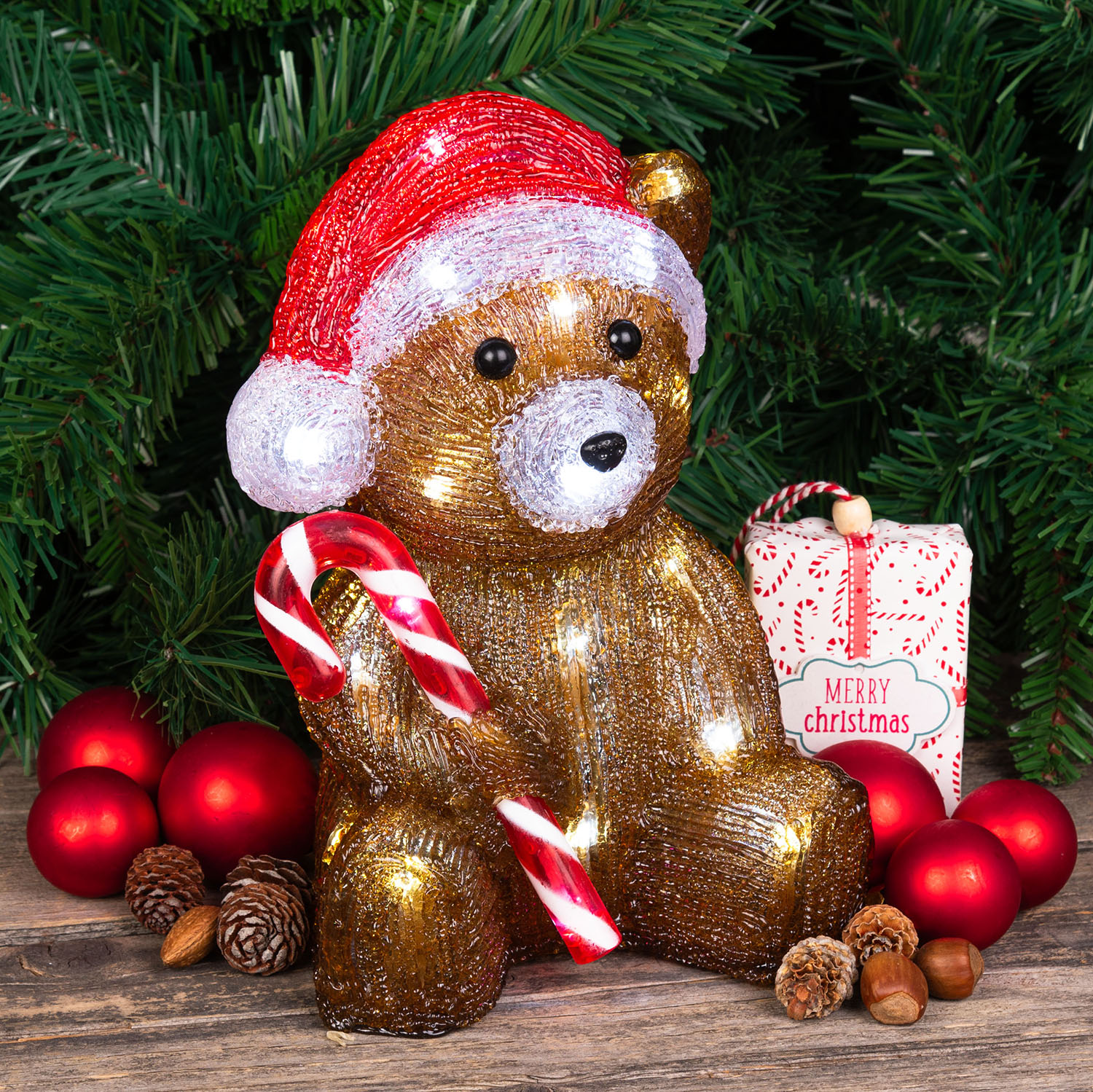 Battery-operated Christmas bear with Candy Cane, h 24 cm, 32 cold white LEDs Battery-operated Christmas bear with Candy Cane, h 24 cm, 32 cold white LEDs