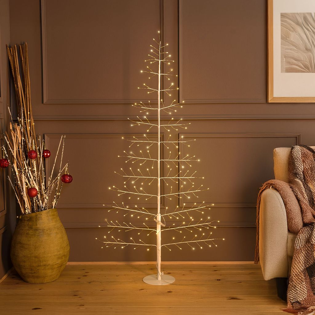 Albero luminoso bianco 2D con rami e microLED collocato vicino alla parete